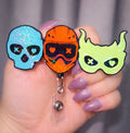 Masked Men Holo Badge Reel
